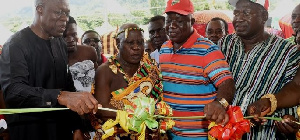 Amissah-Arthur assists Nana Bosoma Aso Nkrawir to cut the tape.