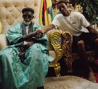 Wijnaldum (right) in a handshake with National Chief Imam