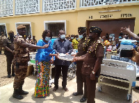 Mrs Angela Alorwu-Tay donating some items to the prison officers