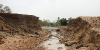 Rain water has knocked down the bank leaving it split in two halves