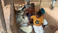 People in the process of making gari