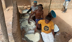 People in the process of making gari