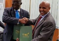 Aviation Minister Joseph Adda and Ethiopian Airlines CEO, Tewolde GebreMariam after signing the MoU