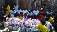 Players of the Roling Rockets in a group photo with reps from Binatone Ghana