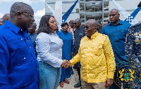 President Nana Addo Dankwa Akufo-Addo (right) with his hands locked with Sarah Adwoa Safo (left)