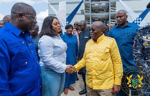 President Nana Addo Dankwa Akufo-Addo (right) with his hands locked with Sarah Adwoa Safo (left)