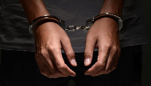 File photo of a person in handcuffs