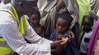 A child being injected with vaccine