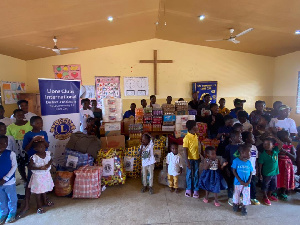 The Lions Club members with the children at the orphanage