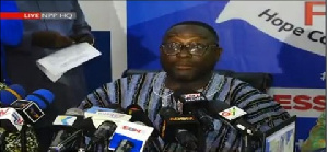 NPP Communications Director, Yaw Buabeng is addressing the media