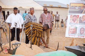 NUGS president breaking ground for the construction of classroom block in Kanania