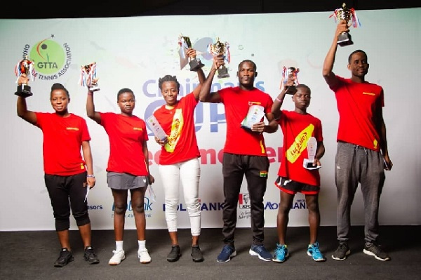 The winners displaying their awards