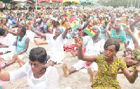 File photo of women praying at AGLOW for Christ event.