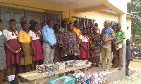 Dr Mark Kurt Nawaane in a group picture with GES officials and some of the beneficiaries