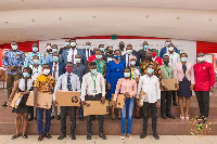 Some beneficiary students with officials of the university and corporate partners