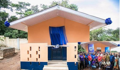 Newly constructed toilet at the Akropong School for the Deaf. inset: Some members of Stanbic Bank