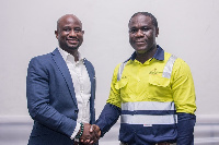 Clarence Nartey (left) in a handshake with Eric Asubonteng