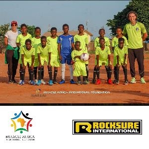 Yasmin Behzadi left, with the young players of Urban Africa Youth Academy and their coach