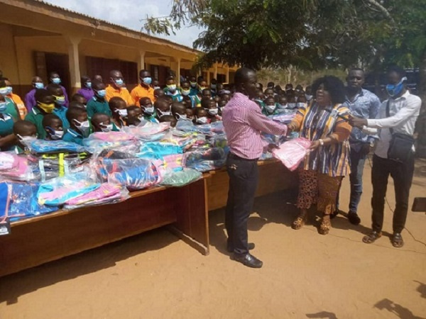 Prophetess Jules Nhyira Wallace donating the items to the head teacher of the school