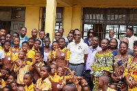 Some key stakeholders in a photo with the school children