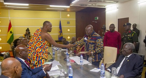 President Akufo-Addo receiving a document from Nana Otuo Siriboe II