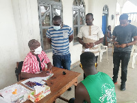 NPP Western Regional Organiser with some party executives at a registration center