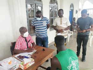 NPP Western Regional Organiser with some party executives at a registration center