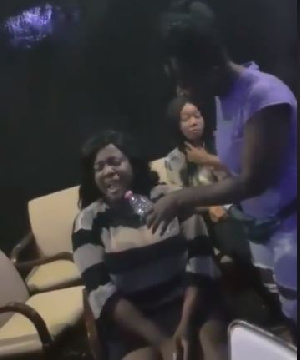 Tracey Boakye (sitting in striped dress)