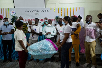 One of the graduands receiving his gift pack