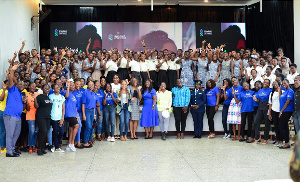 Executives captured in a photo with some students