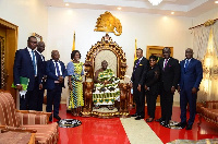 The Asantehene Otumfuo Osei Tutu II and the board and management of ADB in a photo