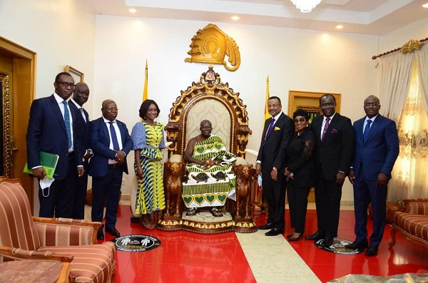 The Asantehene Otumfuo Osei Tutu II and the board and management of ADB in a photo