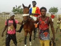 One of the horse riders been led onto the tracks