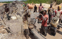 Galamsey operators at site ill-treating the arable land.