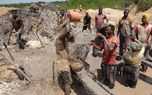 Galamsey operators at site ill-treating the arable land.