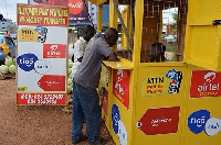 A photo of a MoMo agent attending to a customer