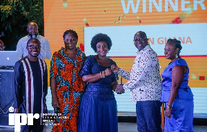 Georgina Asare Fiagbenu, Corporate Communications Senior Manager receiving the award