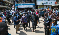 President Akufo-Addo and his entourage visiting a registration center