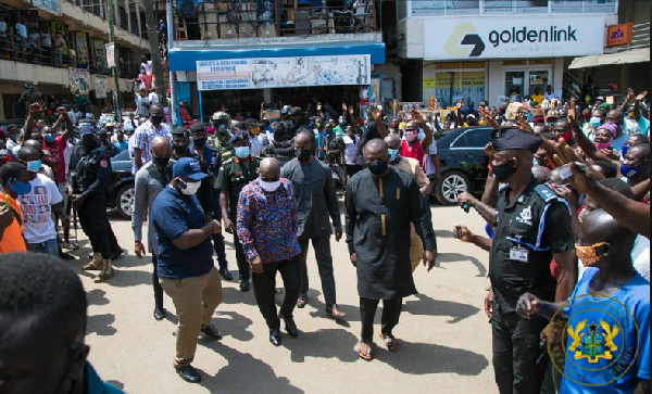 President Akufo-Addo and his entourage visiting a registration center