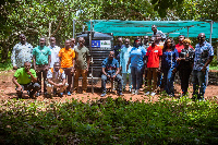 The team in the field with some of the farmers