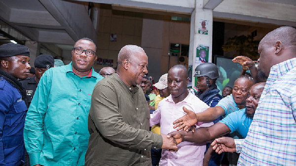 Ofosu Ampofo walking directly behind Mahama