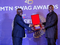 Sports Minister Isaac Asiamah presenting the award to an official of StarTimes