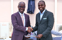 Dr Kojo Taylor (L) receiving a SafeCare certificate from Dr Maxwell Antwi