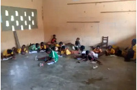 Pupils of Upper West Akim D/A primary school writing on the floor