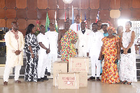 Alfred Obeng-Boateng flanked by church members