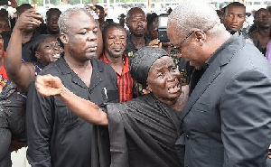 Mahama Consoles Grieving Woman