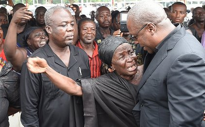 Mahama consoles woman