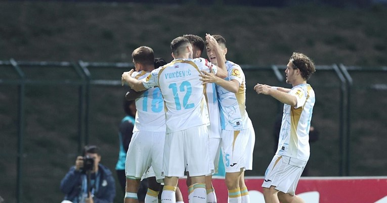 Teammates of Prince Ampem  celebrate with him after scoring