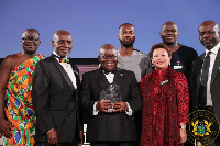 President Akufo-Addo (center) holding his plaque