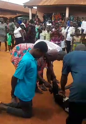 The young man was made to stand infront of the town's palace amid crowd for pacification